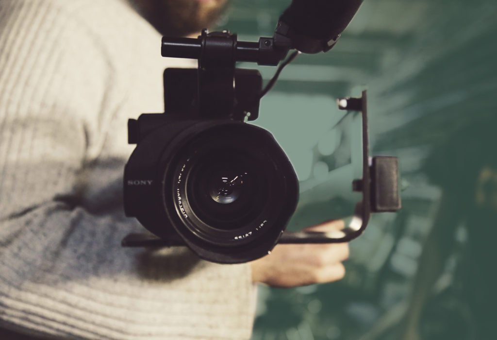 man holding video camera