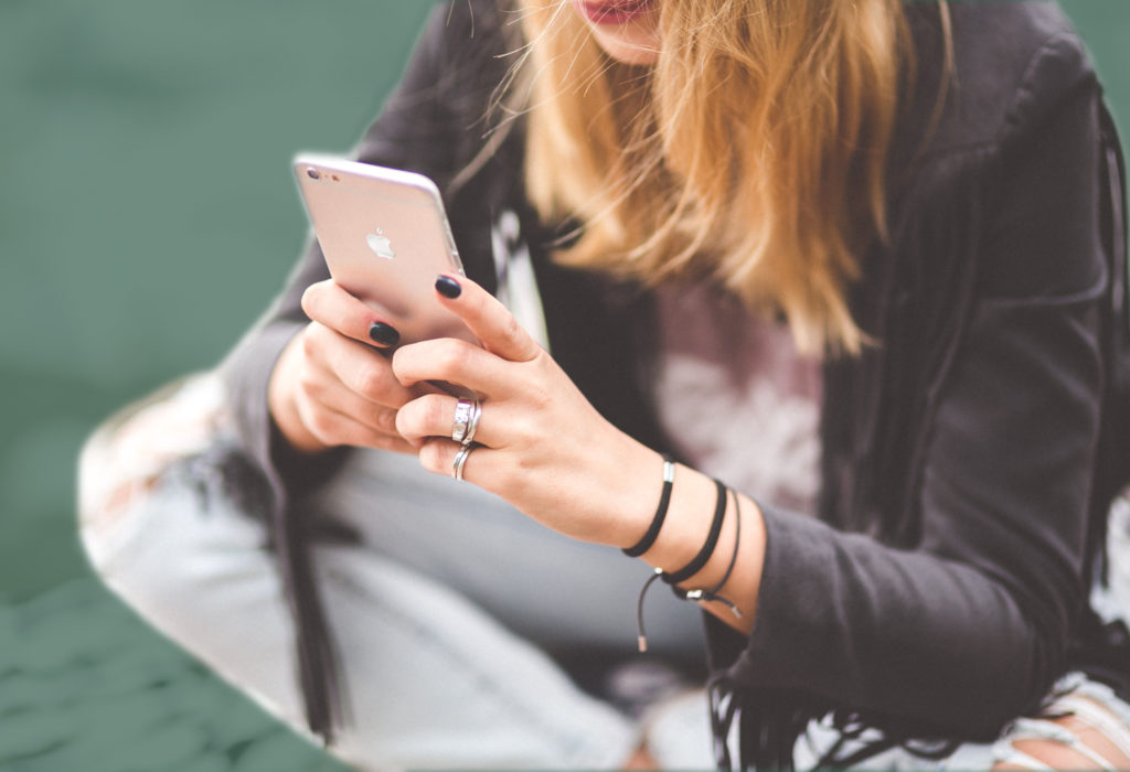 girl using iPhone