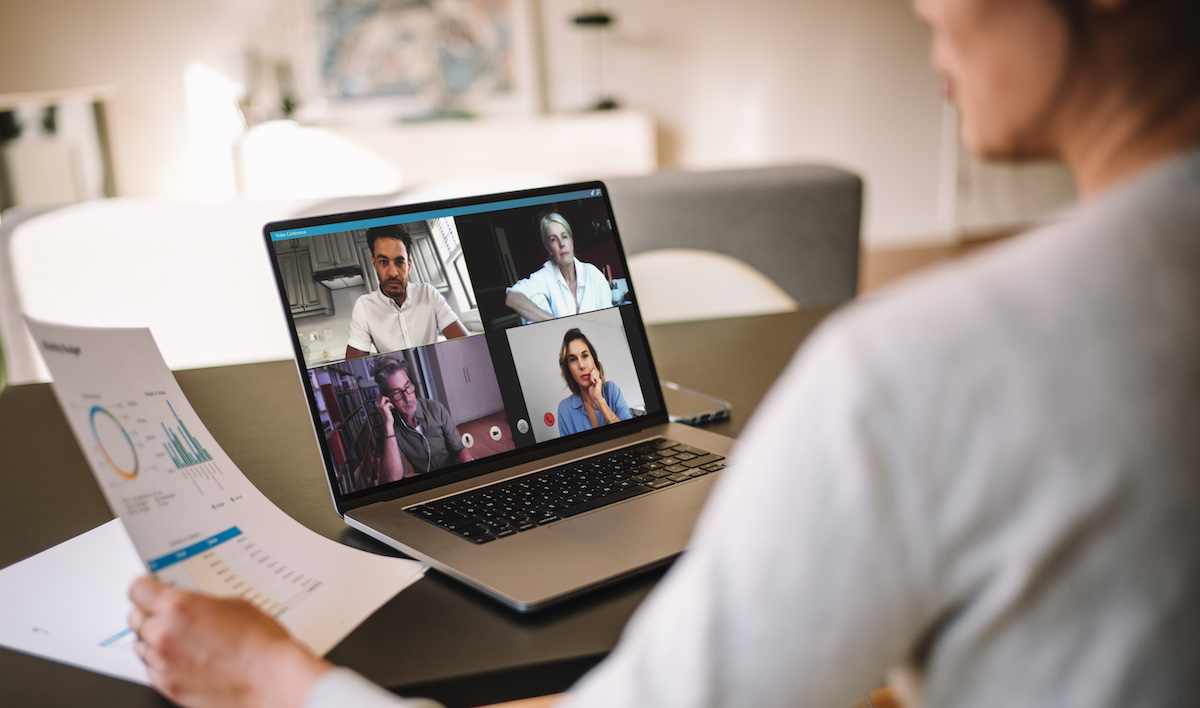 women video conferencing with team