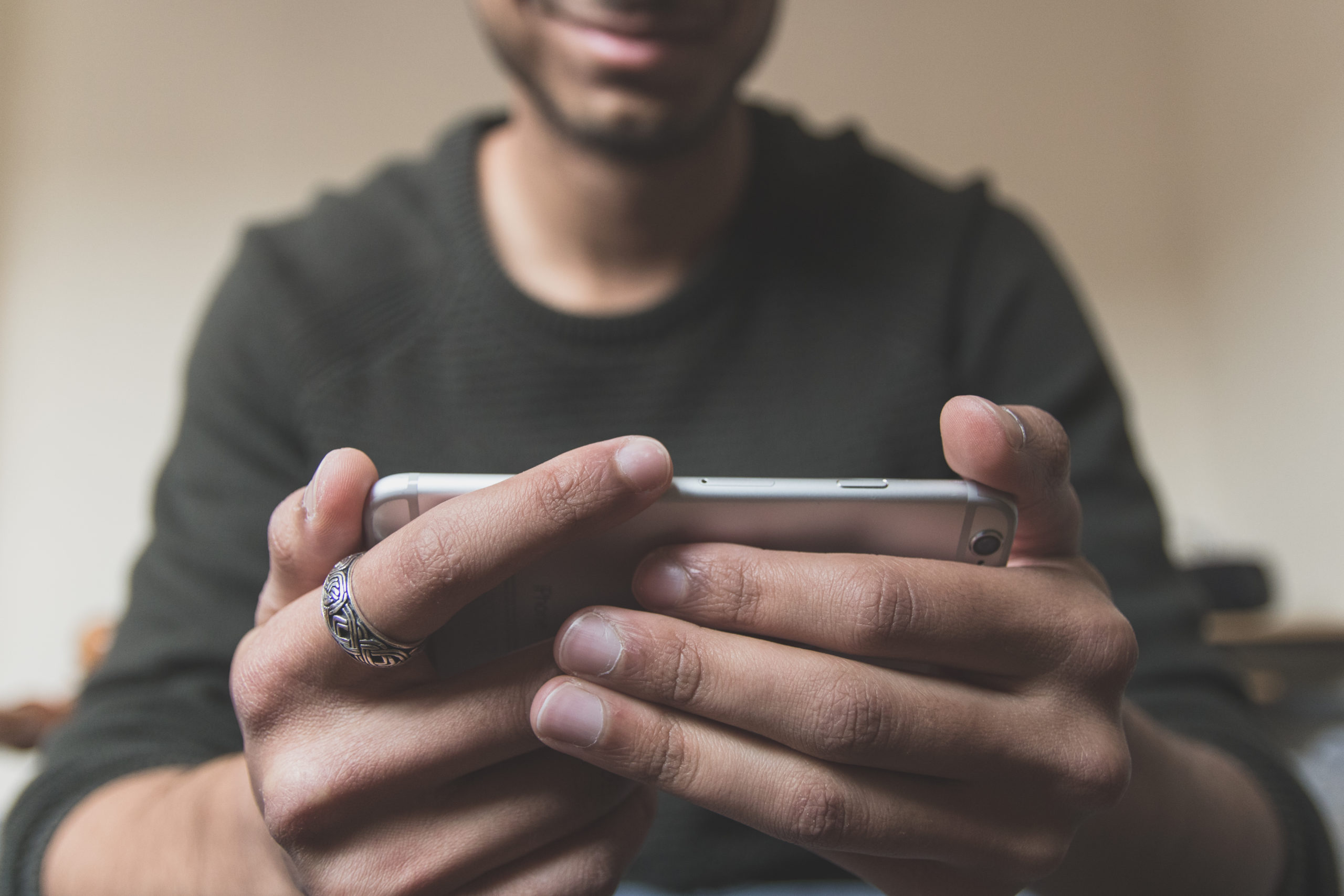 man watching video on a smartphone