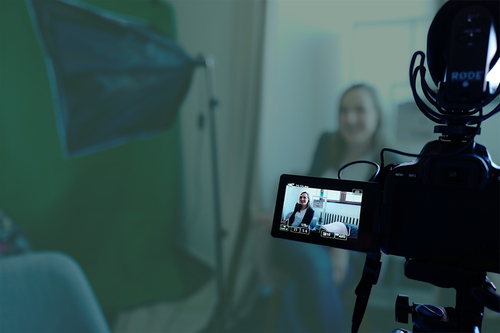 view behind camera of woman waiting to be interviewed