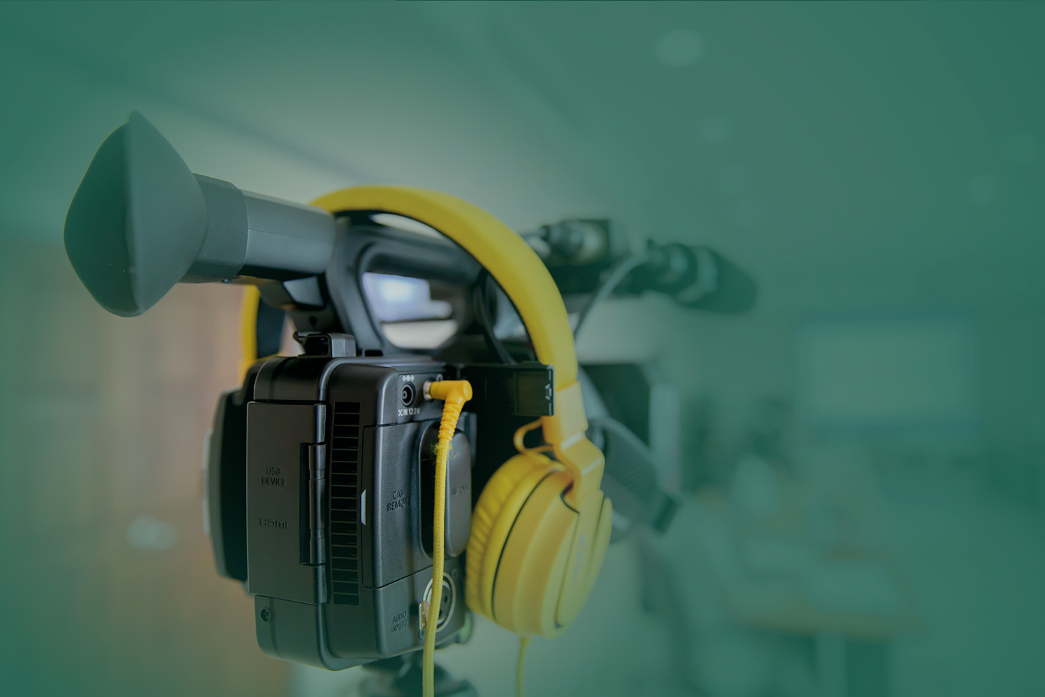 video camera with yellow headphones